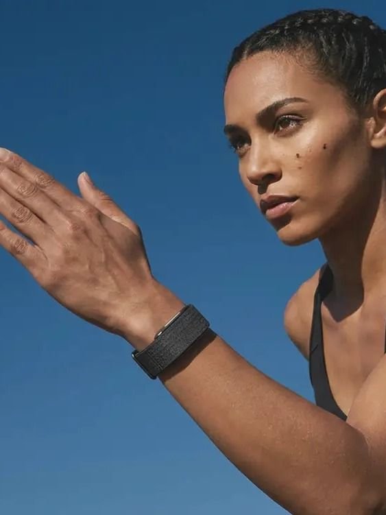 Woman outdoors wearing Hume Band, building metabolic momentum